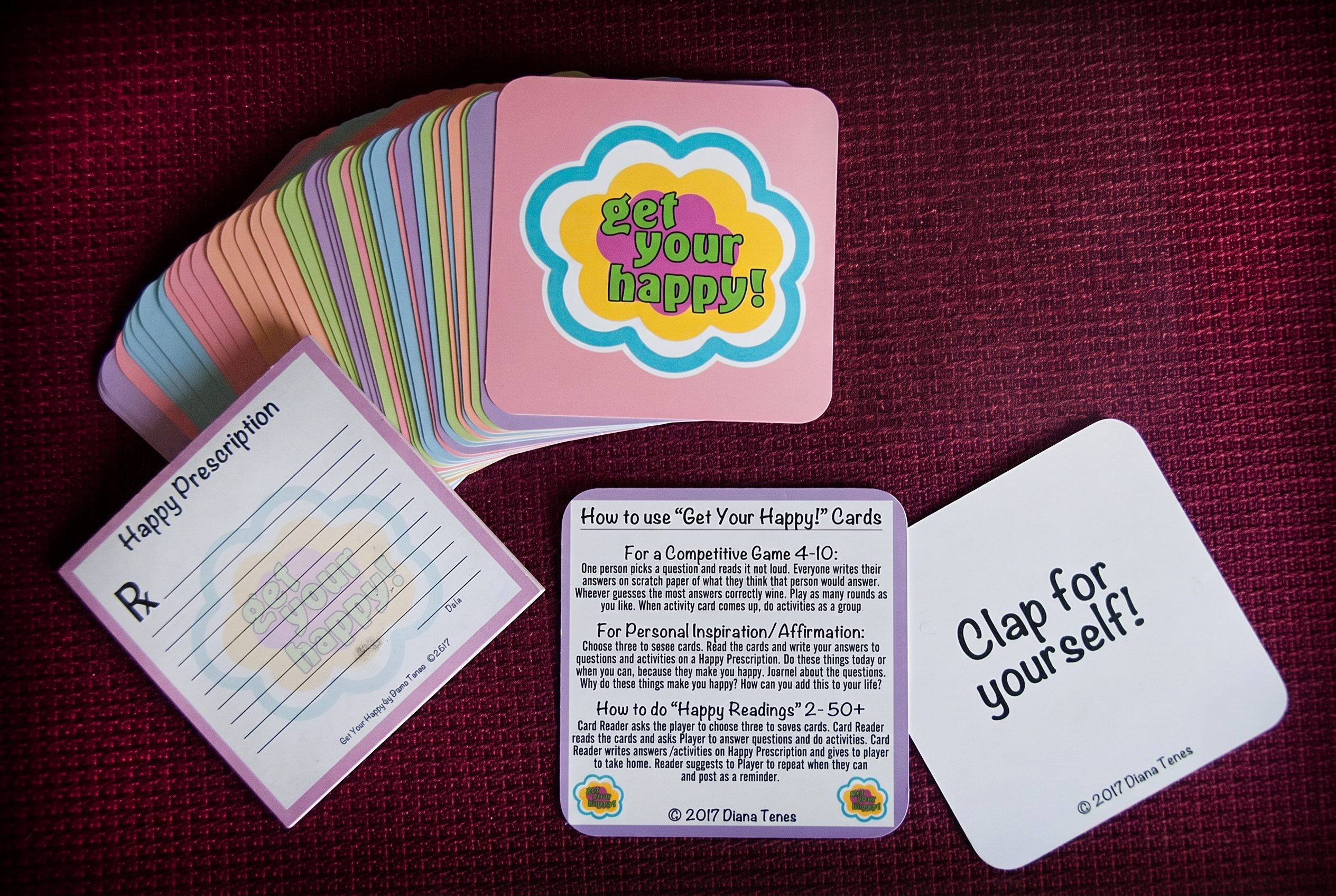 Get Your Happy! 12-Card Mini Deck of conversation cards fanned out on a teal background.